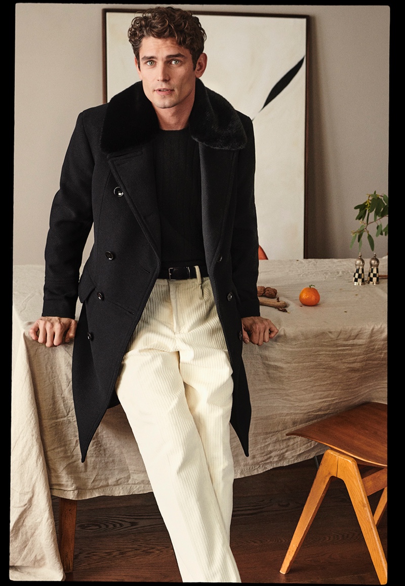 Front and center, Arthur Gosse wears corduroy pants with a double-breasted coat for Mango's holiday 2020 campaign.
