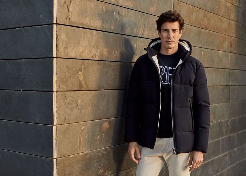 Spanish model Oriol Elcacho wears a Pedro del Hierro logo sweatshirt with a quilted parka.