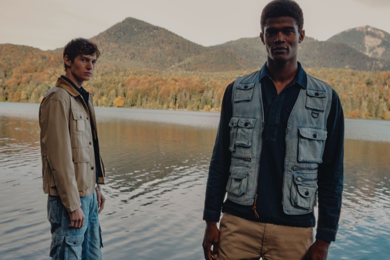 Models Jakob Zimny and O'Shea Robertson sport rugged looks from Mytheresa's POLO Ralph Lauren capsule collection.