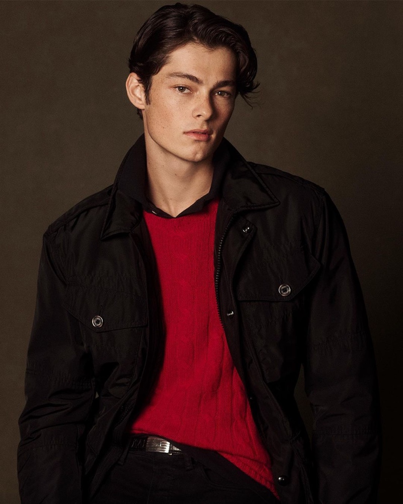 Quinn Liam dons a red cashmere cable-knit sweater from POLO Ralph Lauren's holiday 2020 collection.