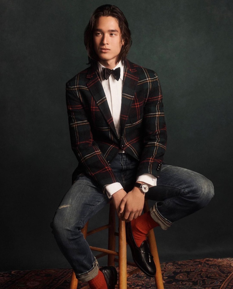 Peter Meyer wears a tartan sport coat with distressed denim jeans from POLO Ralph Lauren.