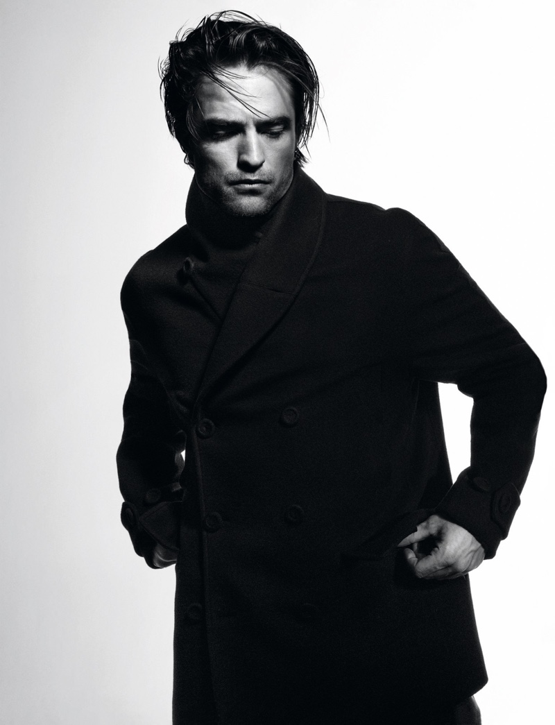 Robert Pattinson dons a double-breasted coat for Dior magazine.