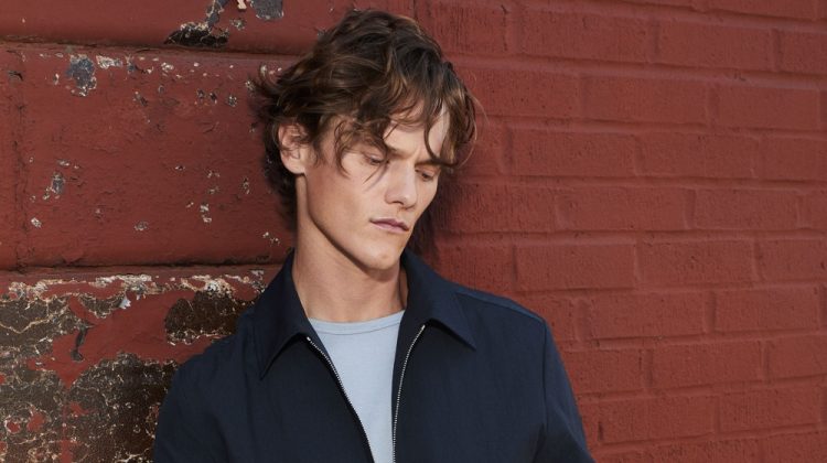 Ryan Keating dons a smart matching look in navy from Theory's spring-summer 2021 collection.