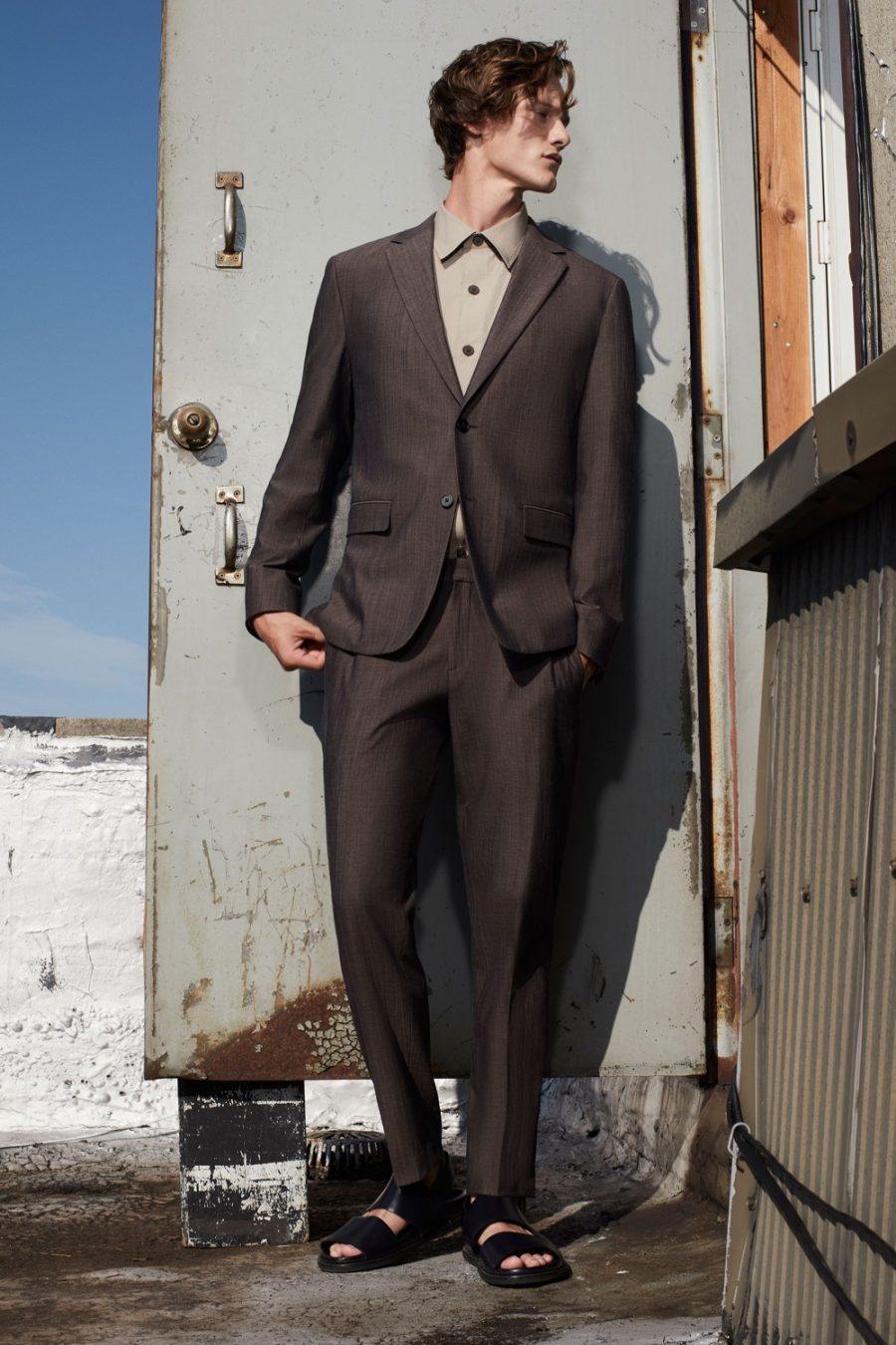 Front and center, Ryan Keating dons a suit from Theory's spring-summer 2021 men's collection.