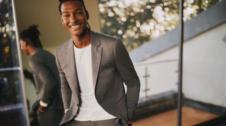 All smiles, Ty Ogunkoya suits up for Tommy Hilfiger's holiday 2020 campaign.