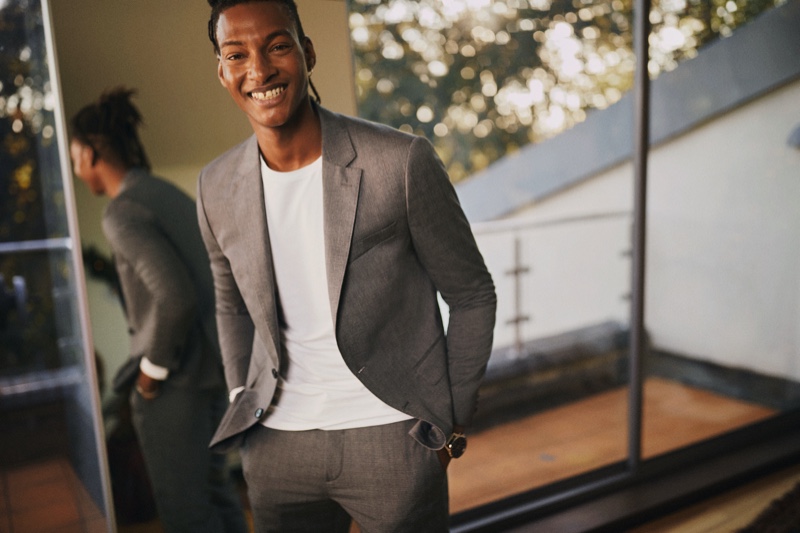 All smiles, Ty Ogunkoya suits up for Tommy Hilfiger's holiday 2020 campaign.