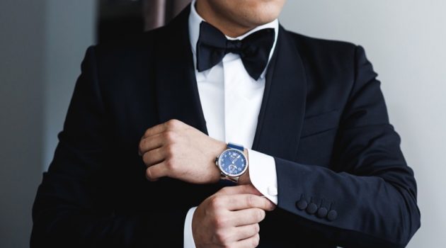 Things to Consider When Buying Second Hand Designer Watches Tuxedo Wearing Man Bow Tie Watch