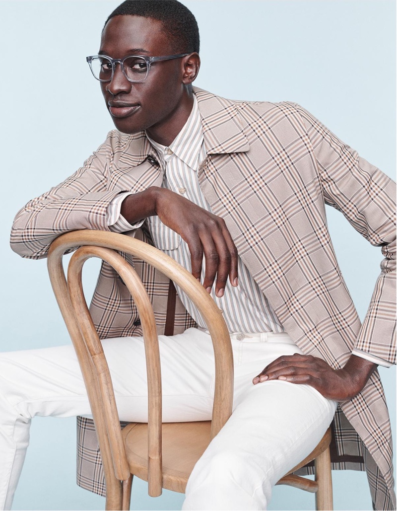 Baba Diop wears Warby Parker's Felix glasses with a low bridge fit in pacific crystal.