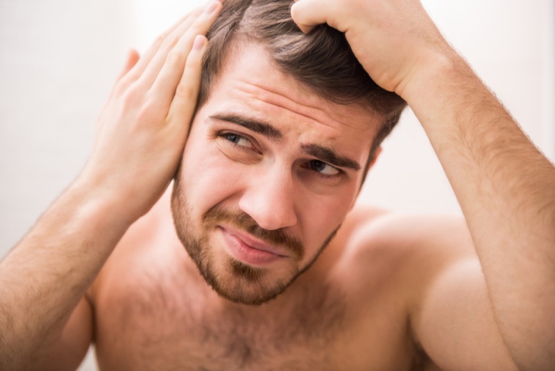 Worrying Man Checking Thinning Balding Hair