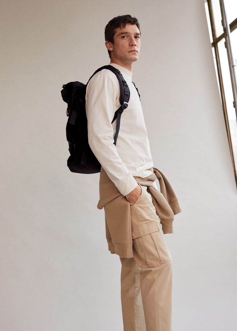 Alexis Petit models a casual look from Mango that includes a long-sleeve pullover and cargo pants.