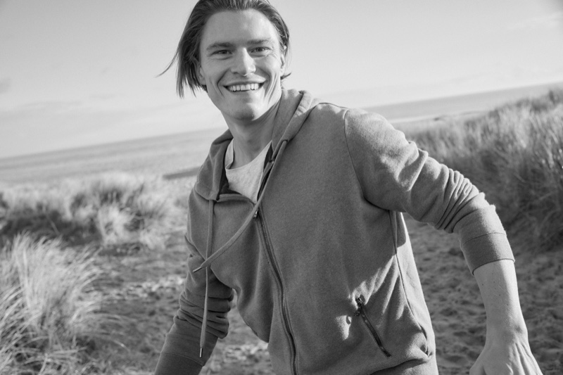 Going casual, Oliver Cheshire wears a men's hoodie by Derek Rose.