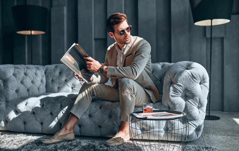 Male Model Tan Suit Grey Couch Elegant Home Decor Magazine