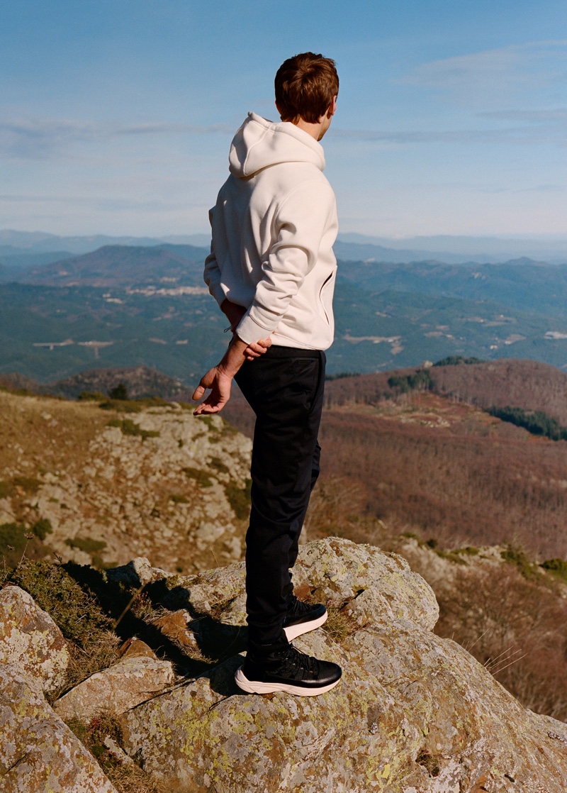 Embracing casual and sporty styles, Clément Chabernaud rocks a white hoodie from Mango Man's Improved collection.