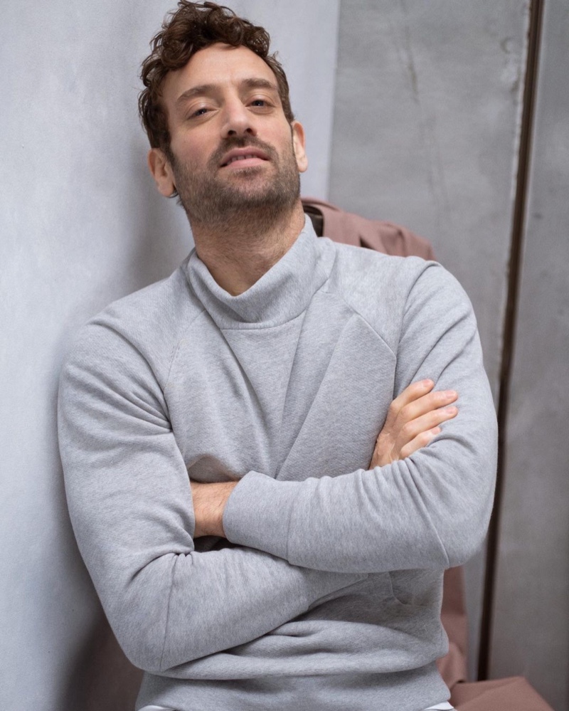 Going casual, Matthew Avedon wears a mock neck sweatshirt by Banana Republic.