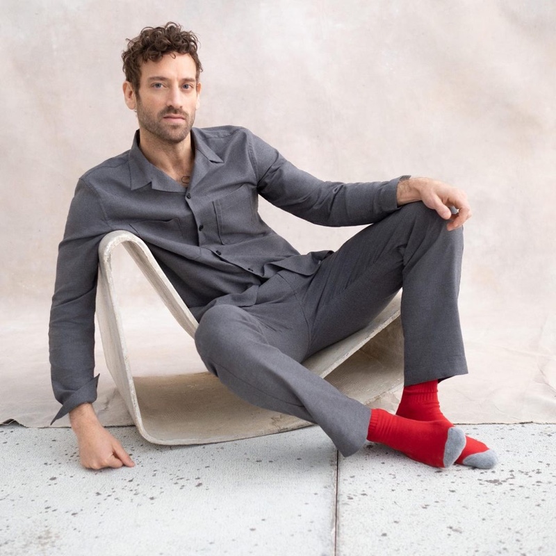 Showcasing sleepwear, Matthew Avedon wears a matching pajama set from Banana Republic.