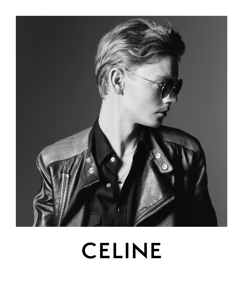 Delivering a side profile, Thomas Brodie-Sangster wears a motorcycle leather jacket for Celine's spring-summer 2021 campaign.