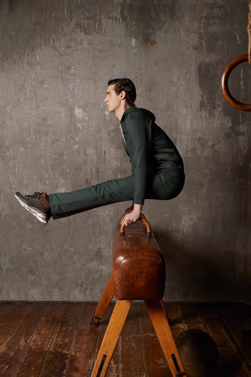 Pictured on a leather pommel horse, Marco Bozzato stars in ZILLI Sport's fall-winter 2020 campaign.