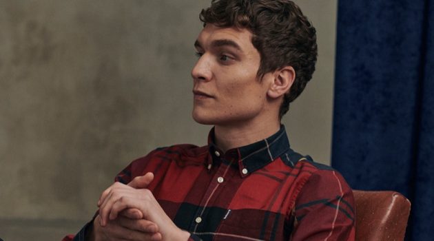 George Models Traditional Styles from Barbour Tartan Collection Relaxing, George Admiraal wears a red tailored shirt from Barbour's new Tartan collection.