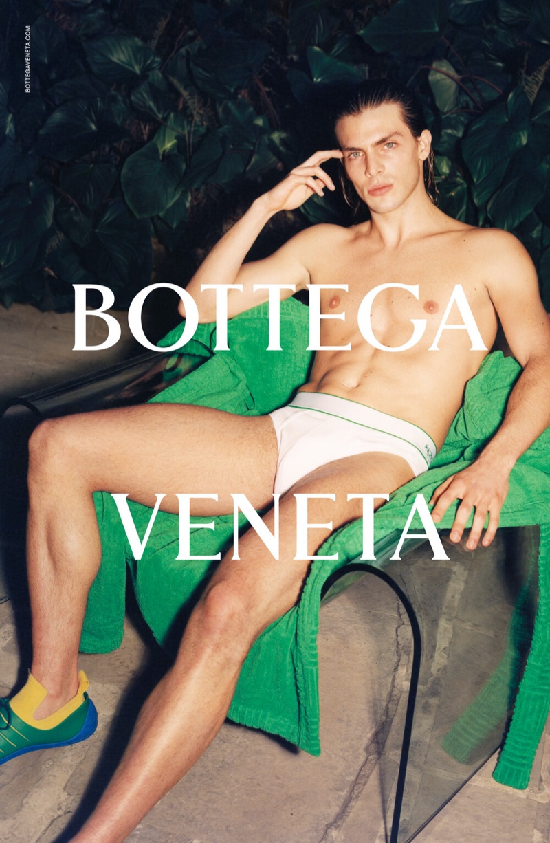 Model Andrea Risso strips to his Bottega Veneta underwear for the brand's spring-summer 2021 men's campaign.