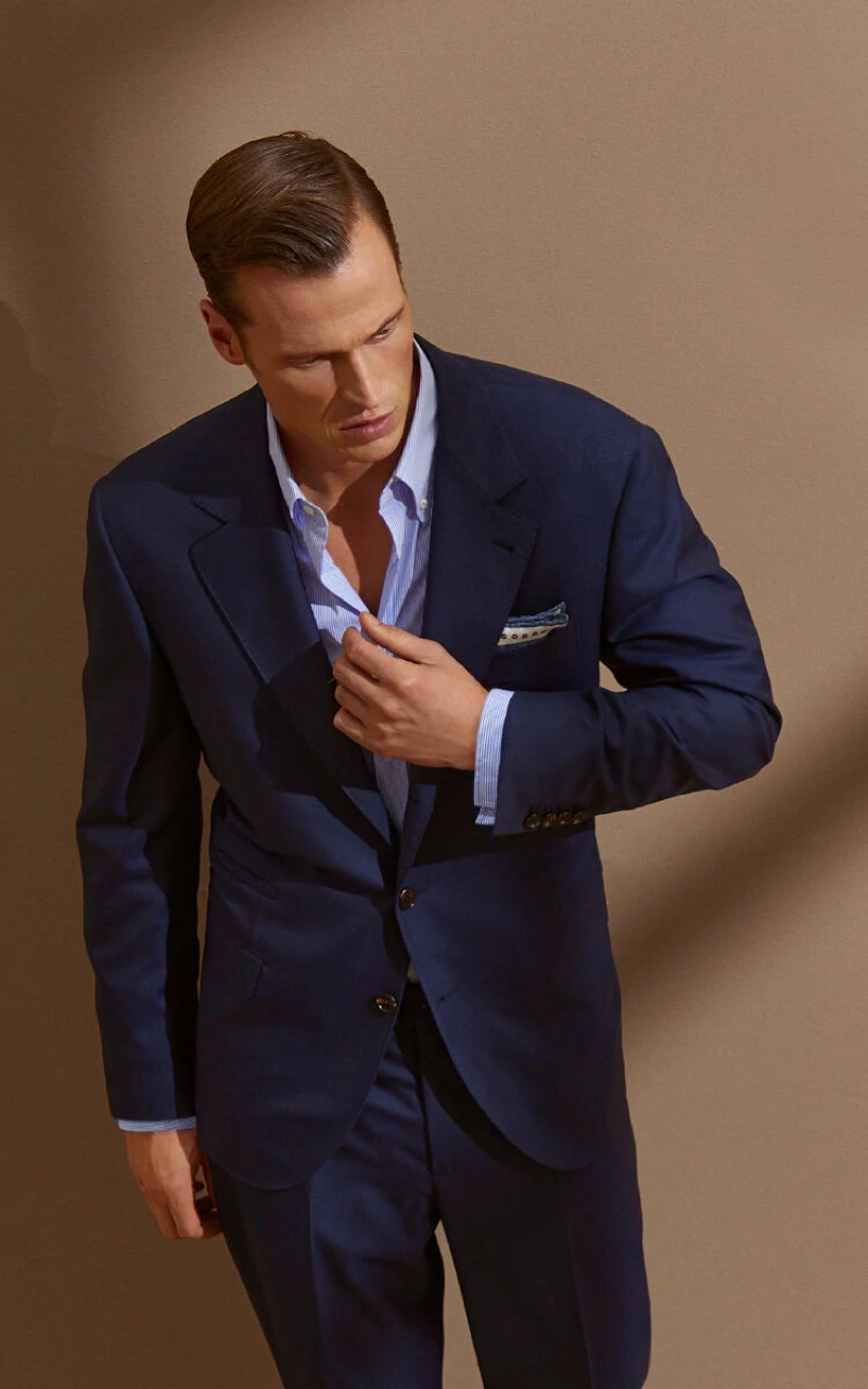 An elegant vision in navy, Lars Burmeister models Brunello Cucinelli's super 150s virgin wool Prince of Wales suit.