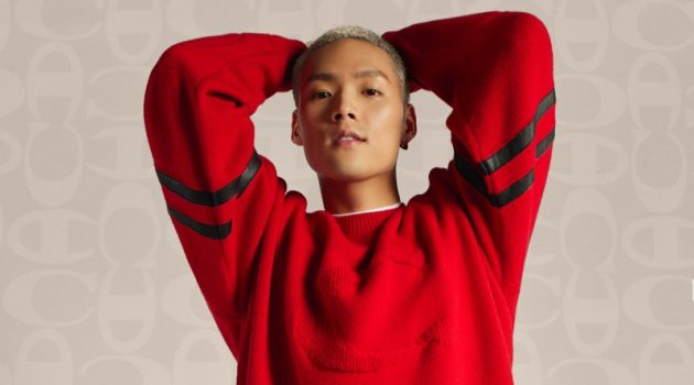 Coach Unveils Champion Collection with Campaign Jeffrey Tung sports a red pullover and black joggers from the Coach x Champion collection.