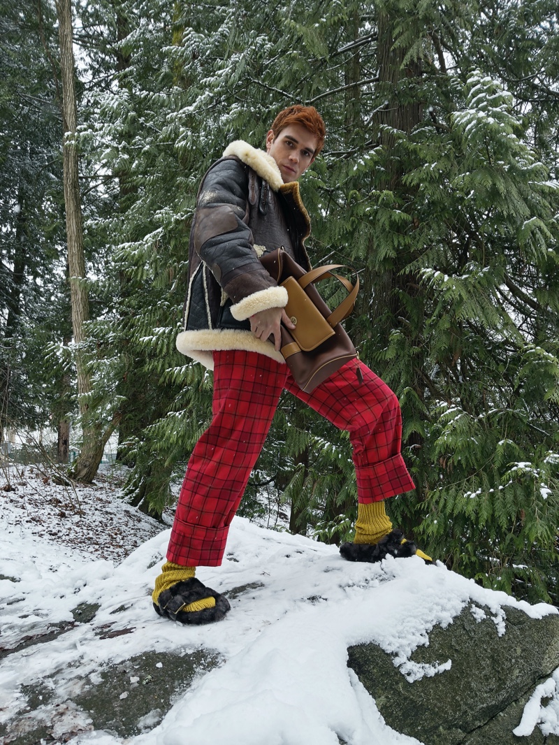 KJ Apa sports a look from Coach's fall-winter 2021 men's collection.