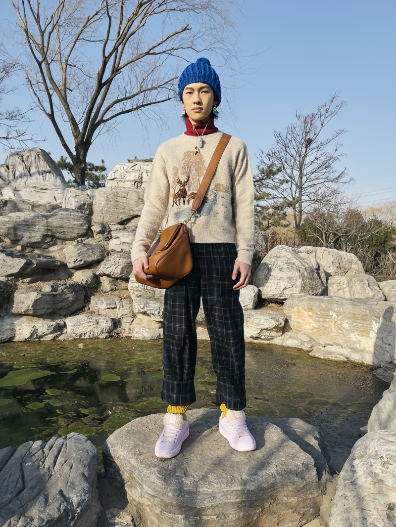 Front and center, Ma Zhe rocks a look from Coach's fall-winter 2021 men's collection.