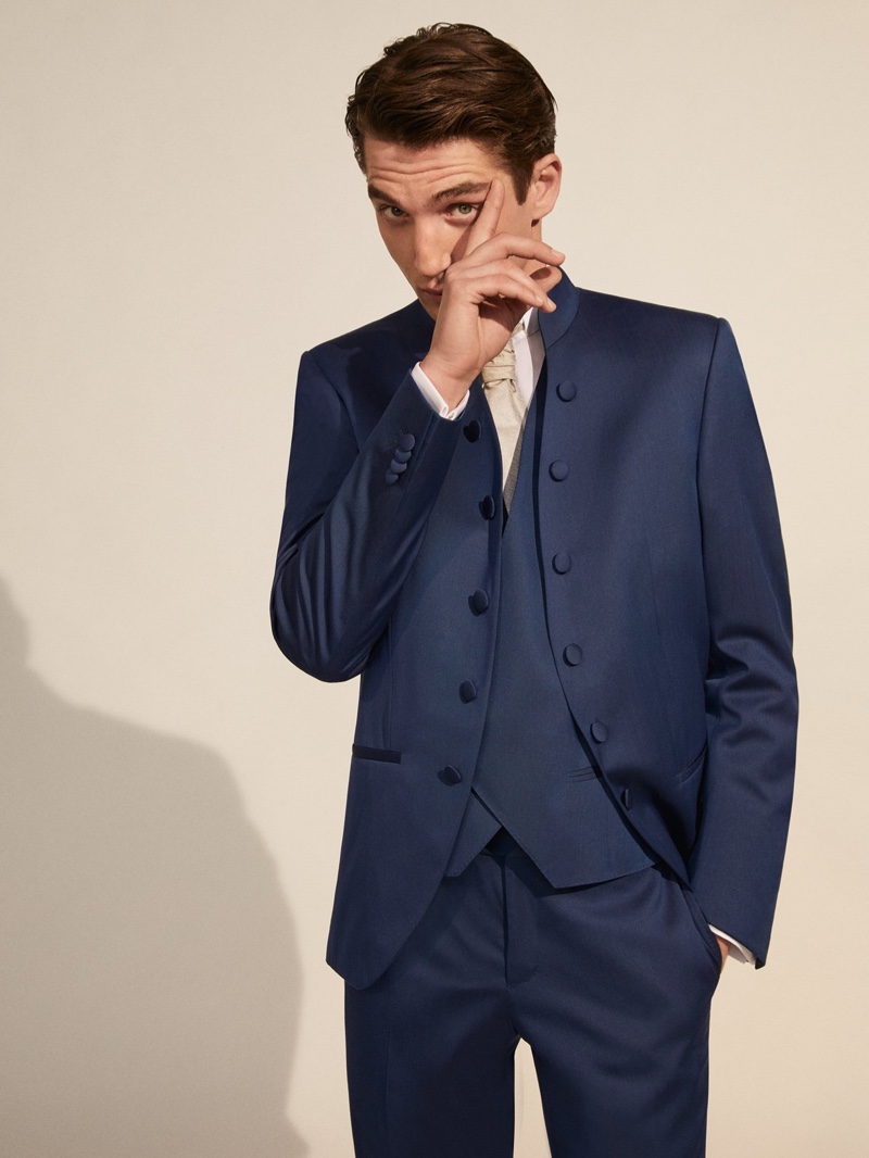 Making a case for navy, Anatol Modzelewski wears a tailored formal look from Corneliani Cerimonia.