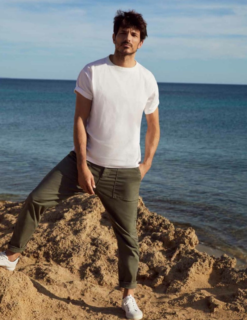 Going casual, Andres Velencoso sports a white t-shirt and relaxed pants from Esprit's spring-summer 2021 men's collection.