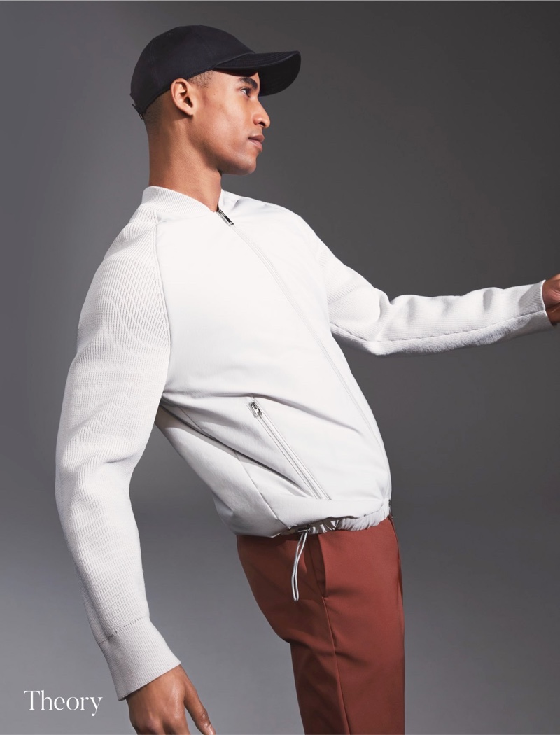 Linking up with Holt Renfrew, Malik Lindo rocks a tech zip bomber from Theory.