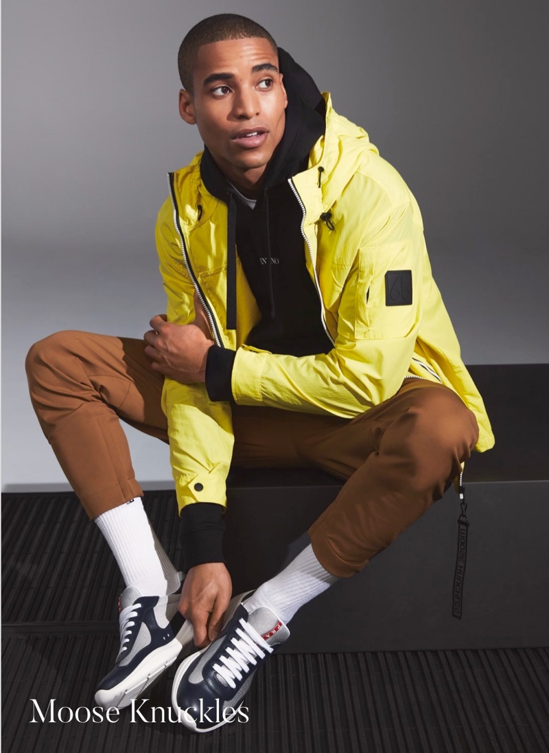 Front and center, Malik Lindo wears a yellow windbreaker by Moose Knuckles.