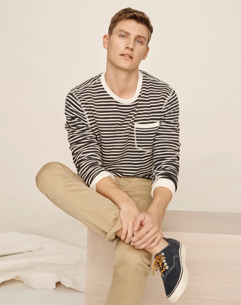 Front and center, Mikkel Jensen wears a J.Crew lightweight striped sun-faded french terry sweatshirt with Wallace & Barnes slim-fit military officer's chino pants.