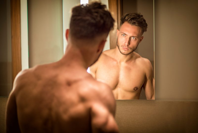 Man Looking in Mirror