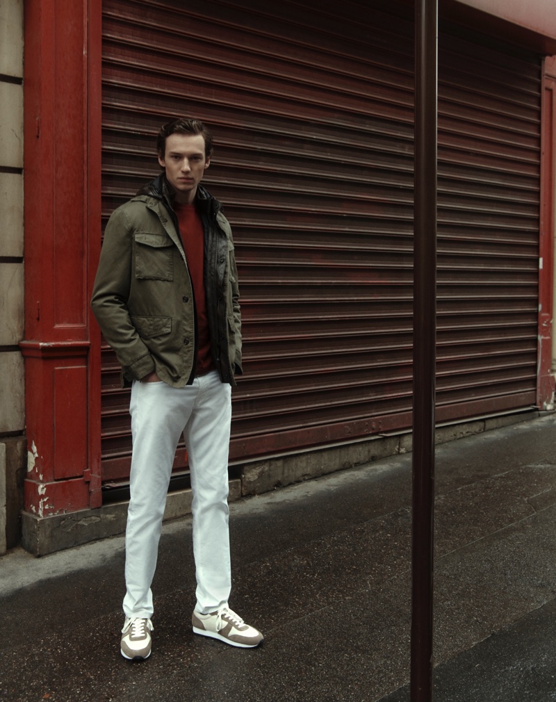 Embracing a pop of color, Jakob Zimny wears a red sweater from Massimo Dutti.