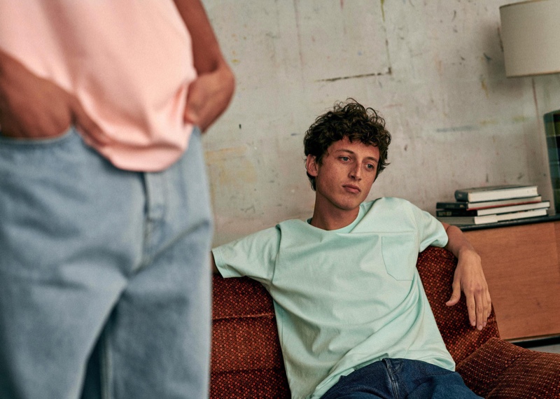 Alexis Maçon-Dauxerre models a pocket tee and denim jeans from Octobre Editions.