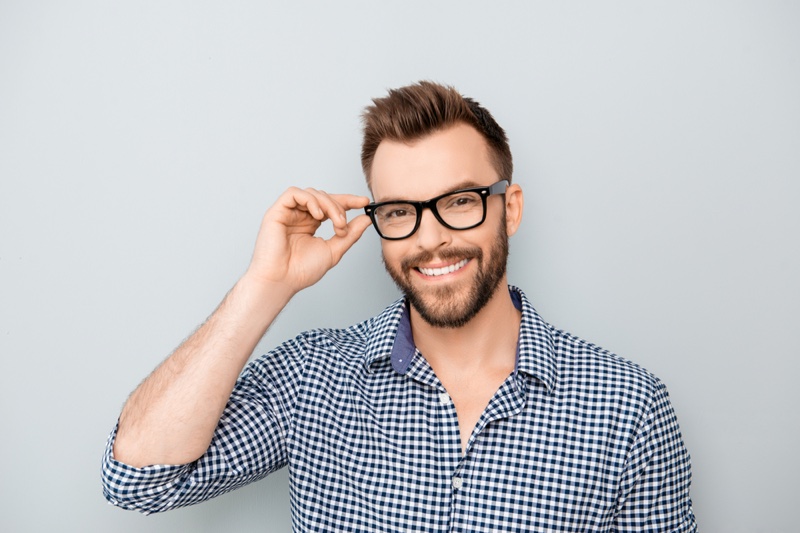 Smiling Model Glasses Checkered Shirt