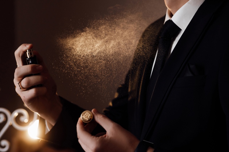 Suit Wearing Man Spraying Cologne Fragrance