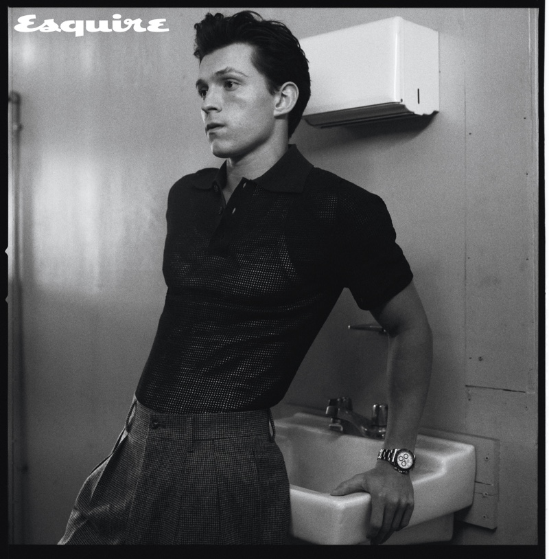 Robbie Fimmano photographs Tom Holland in a Bottega Veneta polo shirt, Dolce & Gabbana tank, and Paul Stuart trousers for Esquire. Holland also dons a Rolex watch.