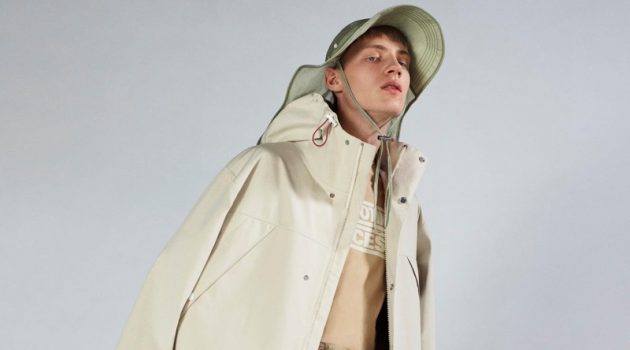 Braien Goes Bold in 2 Moncler 1952 Collection Braien Vaiksaar sports an ivory coat with Bermuda trousers from 2 Moncler 1952.