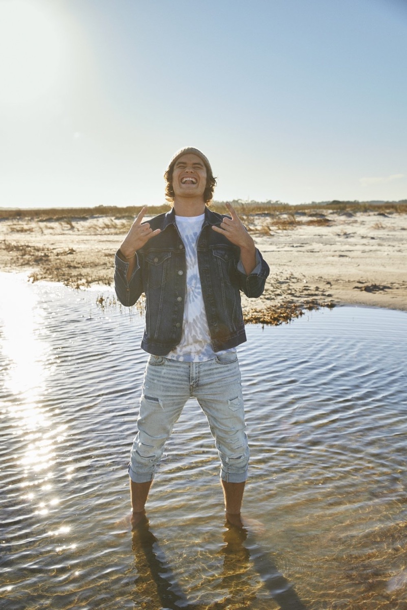 Rocking denim, Chase Stokes appears in American Eagle's spring 2021 denim campaign.