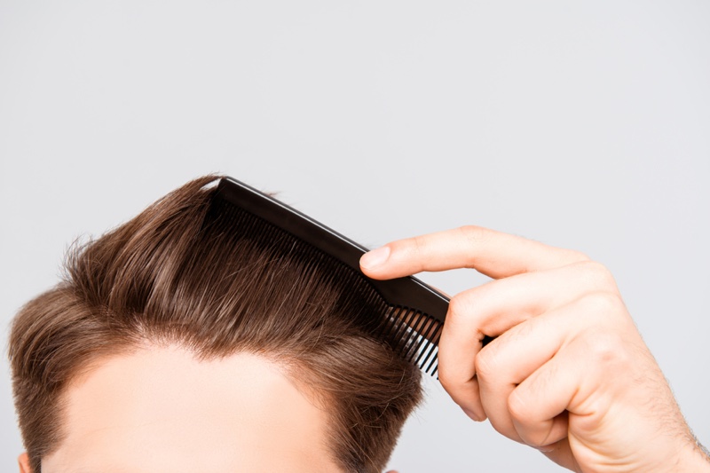 Closeup Man Combing Hair Closeup Man Combing Hair