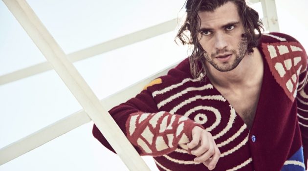 David Corenswet Stars in Mytheresa Spring Campaign Connecting with Mytheresa for its spring-summer 2021 campaign, David Corenswet wears a chunky cardigan by The Elder Statesman.