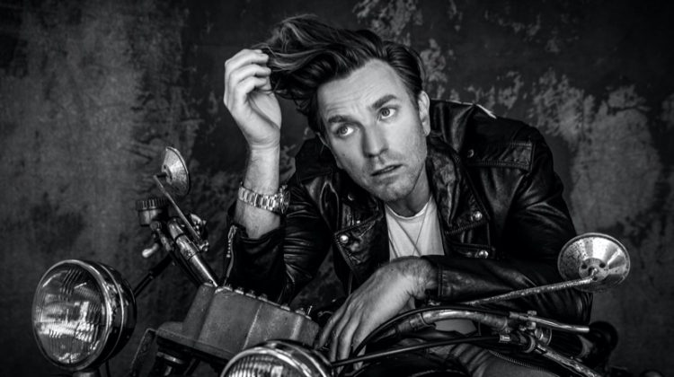 Rocking a Celine leather biker jacket, Ewan McGregor also wears a Tiffany & Co. necklace and TAG Heuer watch for VMAN.