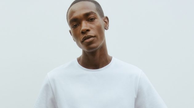 Sharif Idris models a crisp white t-shirt and trousers from Filippa K's Core collection.