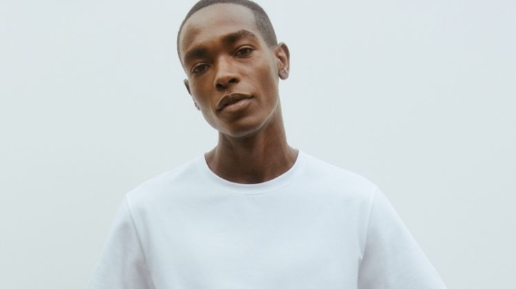 Sharif Idris models a crisp white t-shirt and trousers from Filippa K's Core collection.