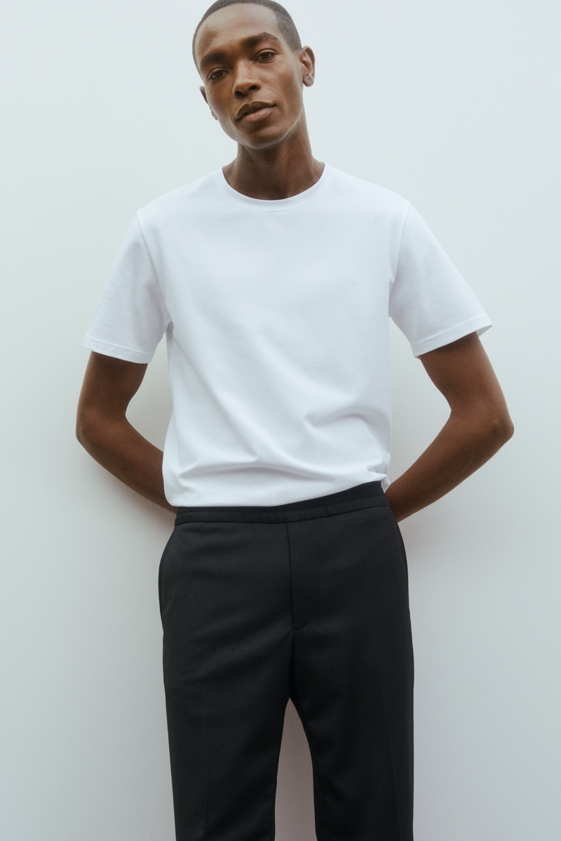 Sharif Idris models a crisp white t-shirt and trousers from Filippa K's Core collection.