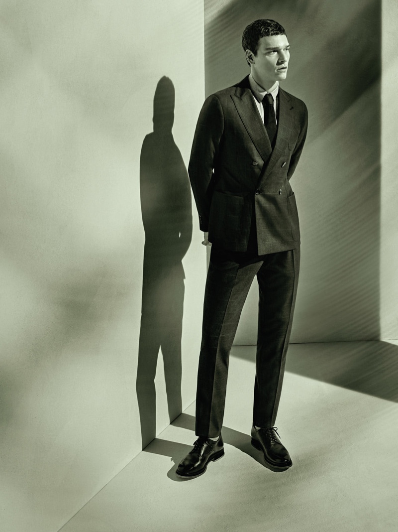 Donning a double-breasted suit, Alexandre Cunha stars in Giorgio Armani's spring-summer 2021 men's campaign.