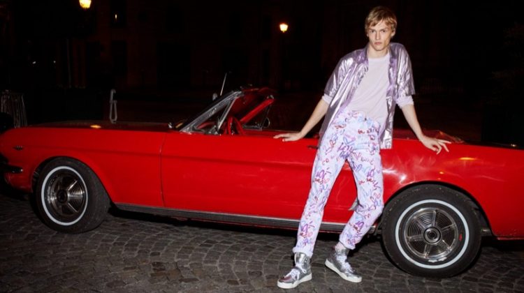 Posing in front of a cherry red convertible, model Kerkko Sariola stars in Isabel Marant's spring-summer 2021 men's campaign.