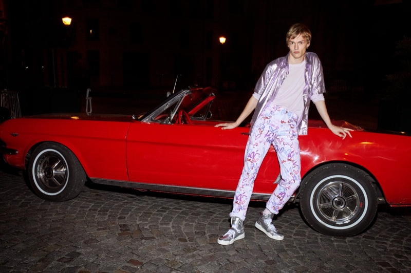 Posing in front of a cherry red convertible, model Kerkko Sariola stars in Isabel Marant's spring-summer 2021 men's campaign.