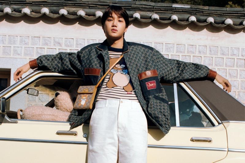 Front and center, Kai sports a striped teddy bear sweater and leather bag from his Gucci capsule collection.